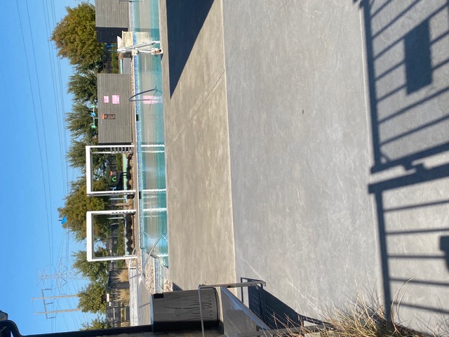 Prairie Ridge at Goodland community pool with modern white cabanas, resort-style amenity in Mansfield TX