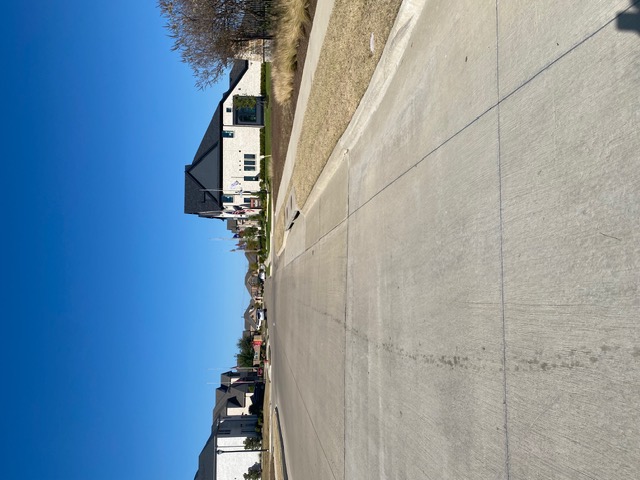 Prairie Ridge streetscape with modern farmhouse homes, white brick and black trim, Mansfield TX