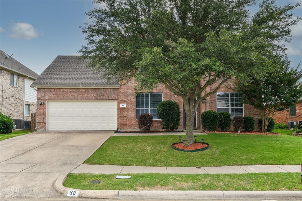 Brick house with a white garage door.