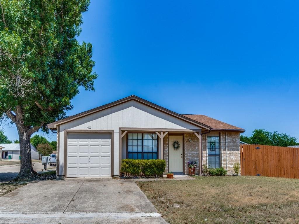 A white suburban house with a garage door.