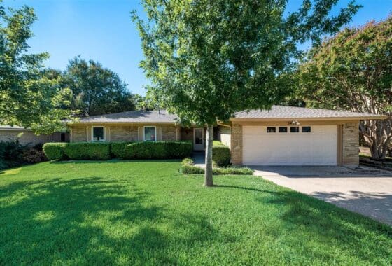 Brick house with a white garage door.