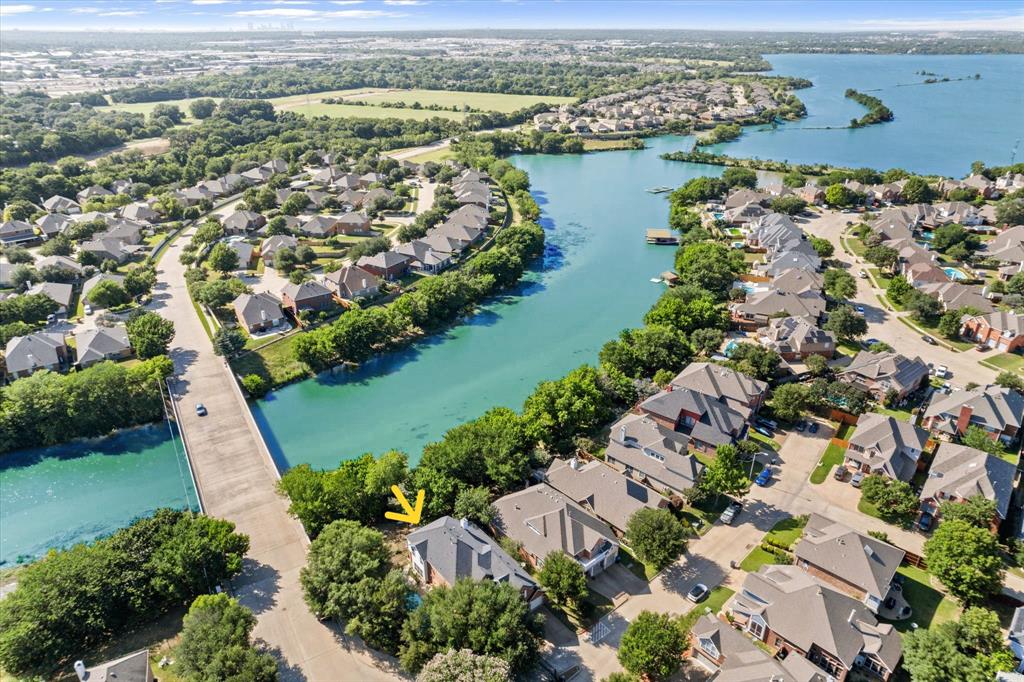 Aerial view of suburban neighborhood by lake.